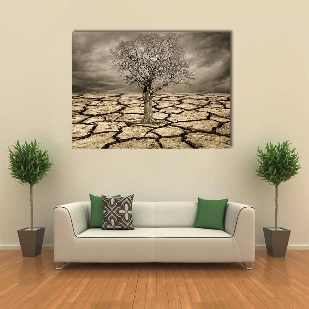Tree on Cracked Mud Canvas Wall Art in gray, beige and brown, single panel hung on a wall