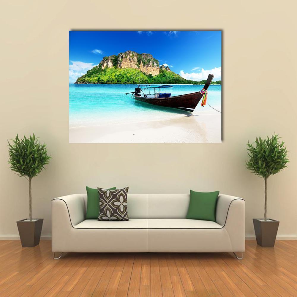 Longtail Boat on Tropical Island Canvas Wall Art in white, green and blue, single panel hung on a wall