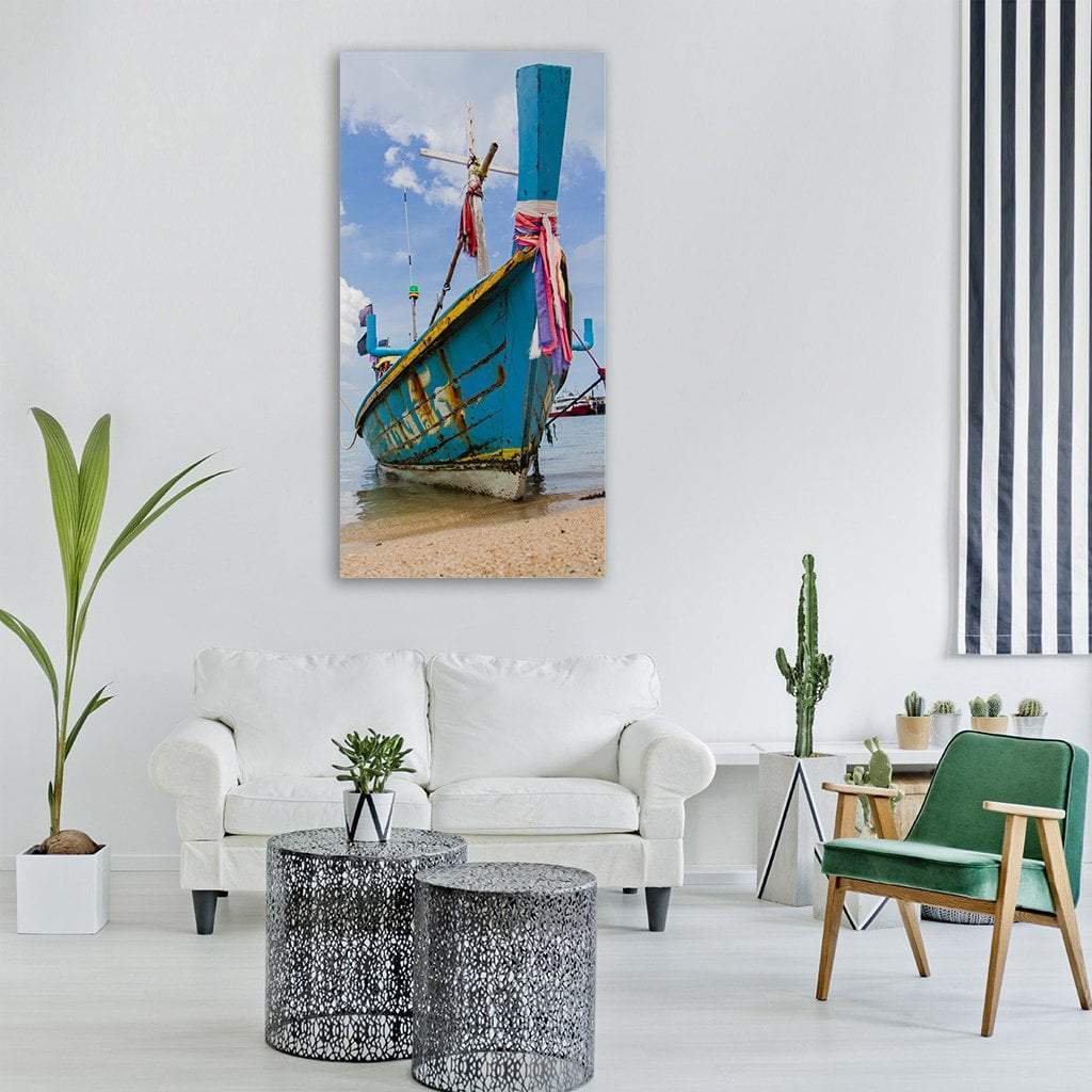 Long-tail Boat on Sandy Beach Vertical Canvas Wall Art in white, beige and blue, single vertical panel hung on a wall