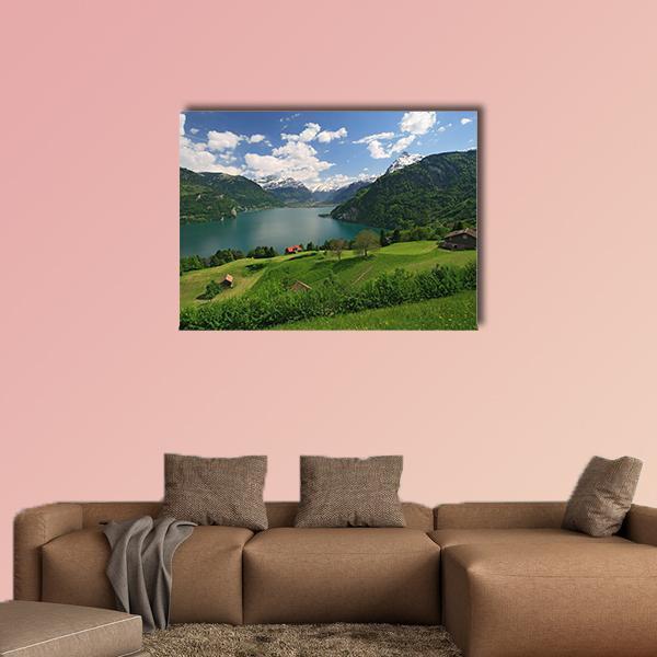 Farms by Lake Lucerne Canvas Wall Art in white, green and blue, single panel hung on a wall