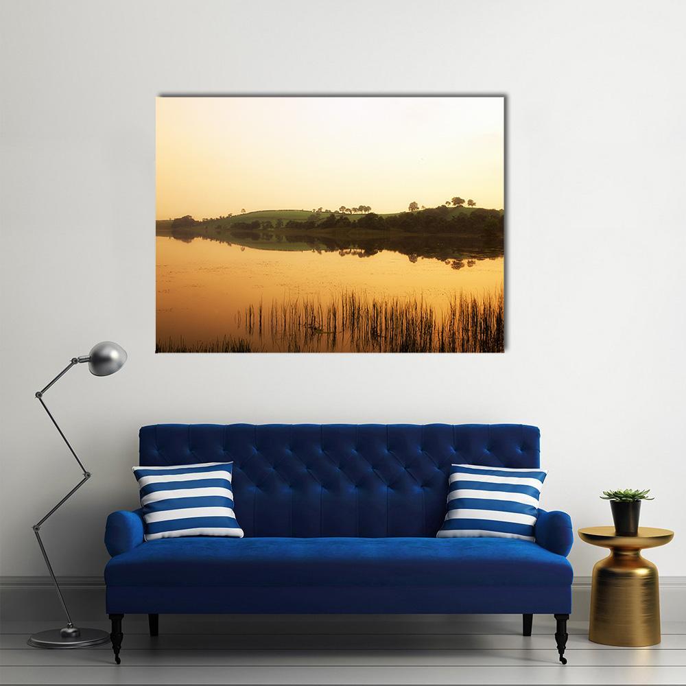 Reeded Lake at Golden Dusk Canvas Wall Art in brown, gold and yellow, single panel hung on a wall