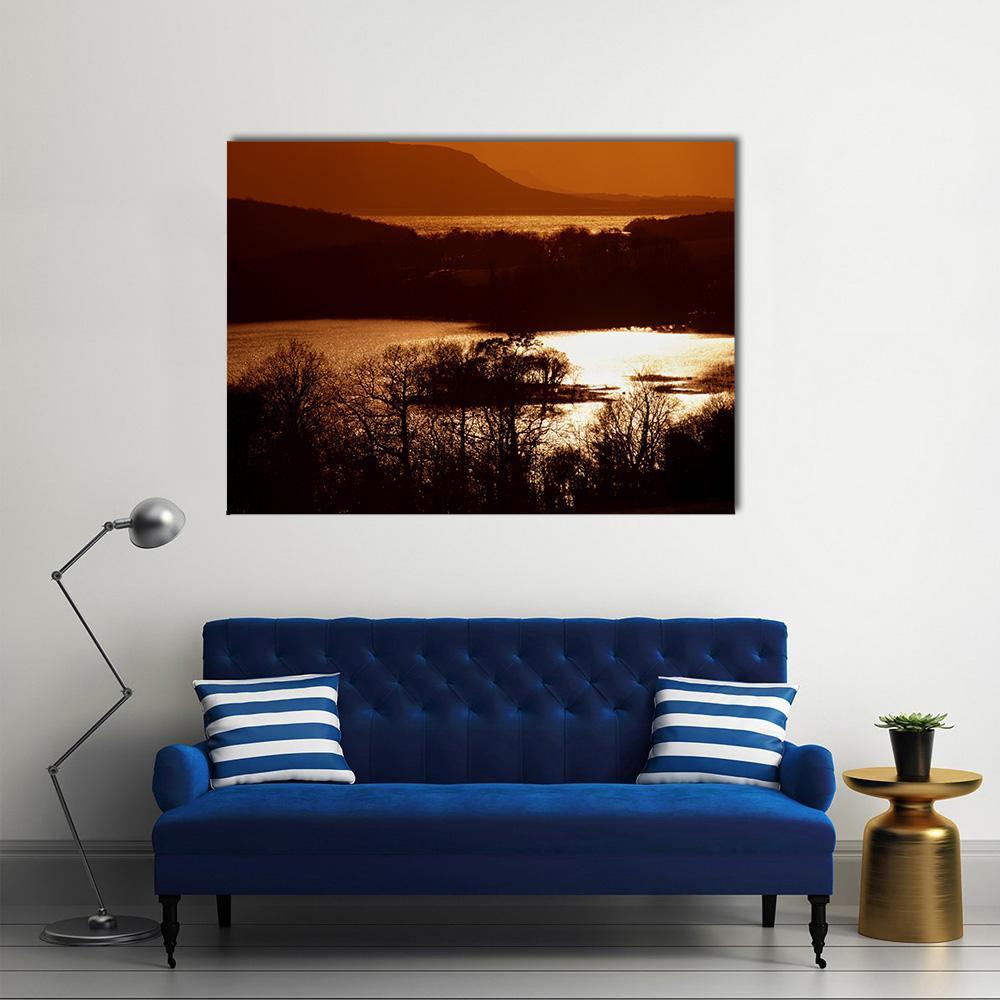 Lower Lough Erne at Sunset Canvas Wall Art in black, brown and orange, single panel hung on a wall