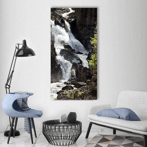 Lower Ogwen Waterfall Vertical Canvas Wall Art in black, white and gray, single vertical panel hung on a wall