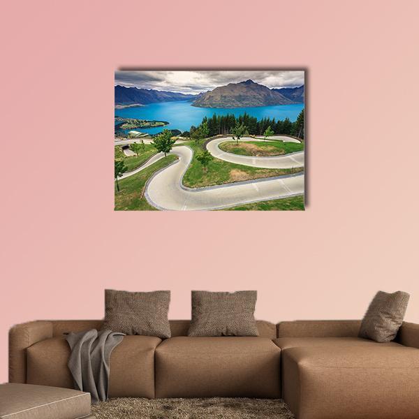 Queenstown Skyline Luge Track Canvas Wall Art in gray, green and blue, single panel hung on a wall