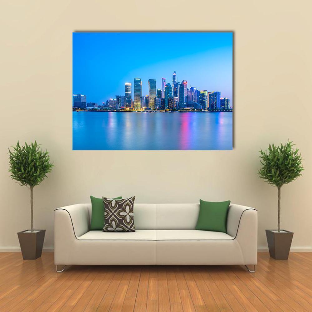 Lujiazui Night Skyline with River Reflection Canvas Wall Art in blue, single panel hung on a wall