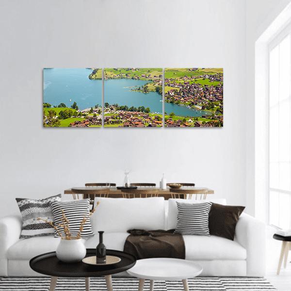 Lungern Village, Switzerland Panoramic Canvas Wall Art in green and blue, hung on a wall