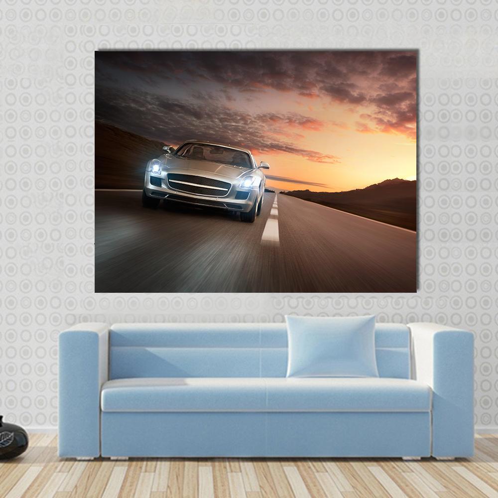 Sports Car on Highway Canvas Wall Art in black, gray and orange, single panel hung on a wall