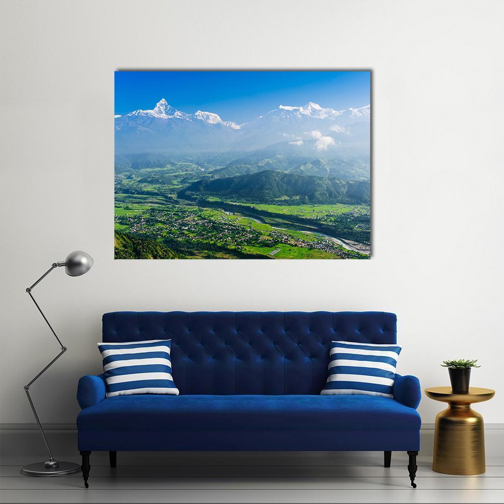 Machapuchare and Pokhara Nepal Canvas Wall Art in white, green and blue, single panel hung on a wall