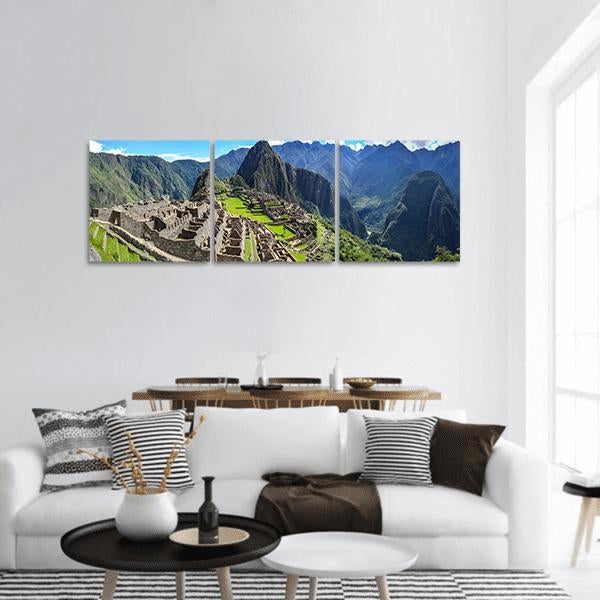 Machu Picchu Ancient Incan Ruins Panoramic Canvas Wall Art in gray, green and blue, hung on a wall