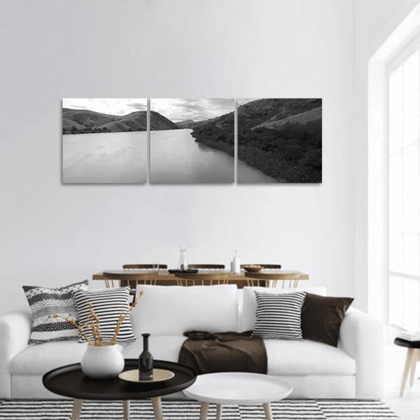 Madagascar River Black and White Landscape Panoramic Canvas Wall Art in black, white and gray, hung on a wall