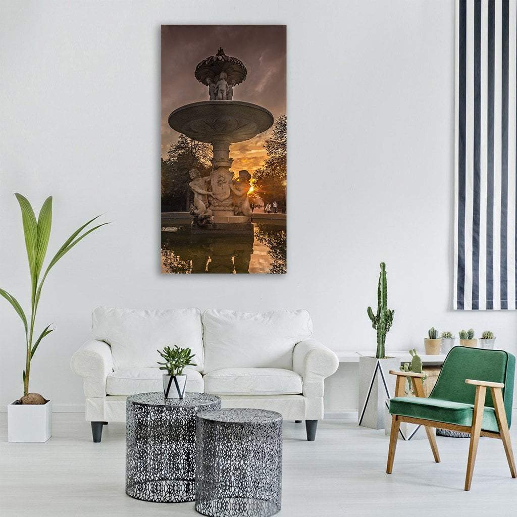Ornate Cherub Fountain at Sunset Vertical Canvas Wall Art in gray, brown and orange, single vertical panel hung on a wall