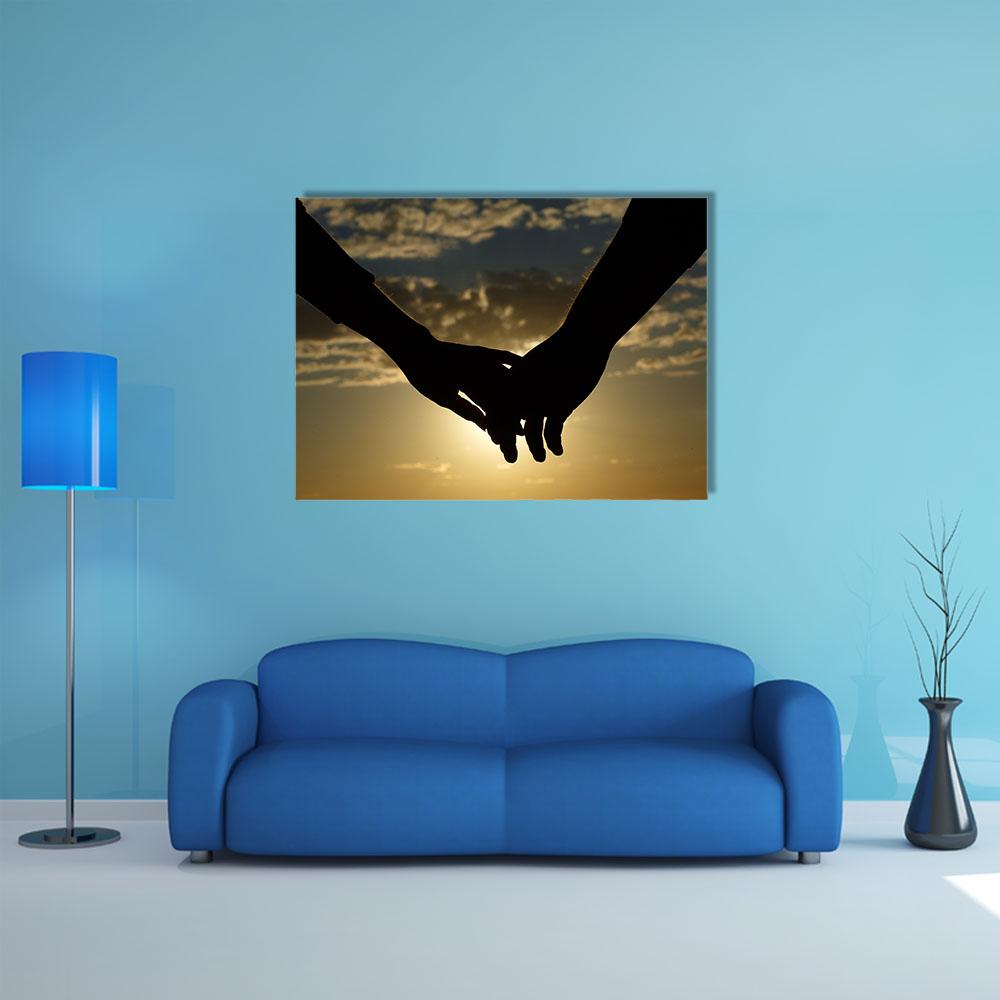 Couple Hands Silhouette at Sunset Canvas Wall Art in black, orange and yellow, single panel hung on a wall