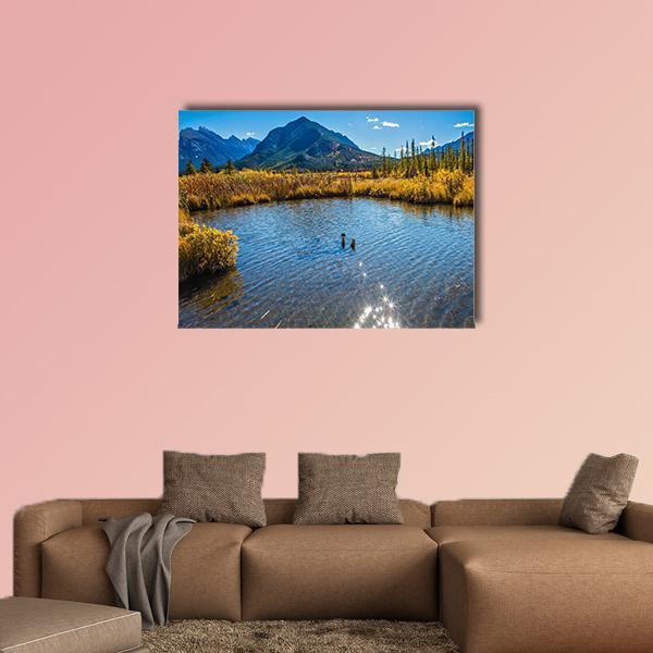 Vermilion Lake Canada Canvas Wall Art in brown, yellow and blue, single panel hung on a wall