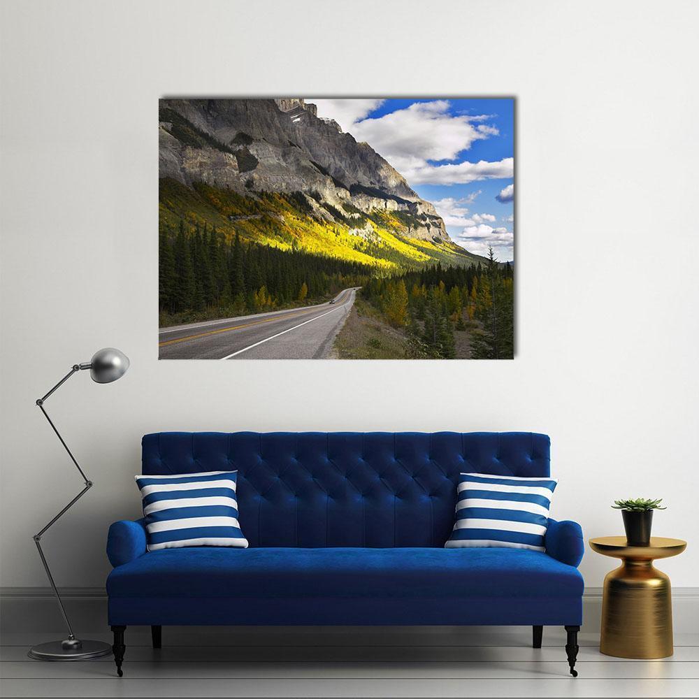 American Mountain Road in Autumn Canvas Wall Art in gray, yellow and blue, single panel hung on a wall