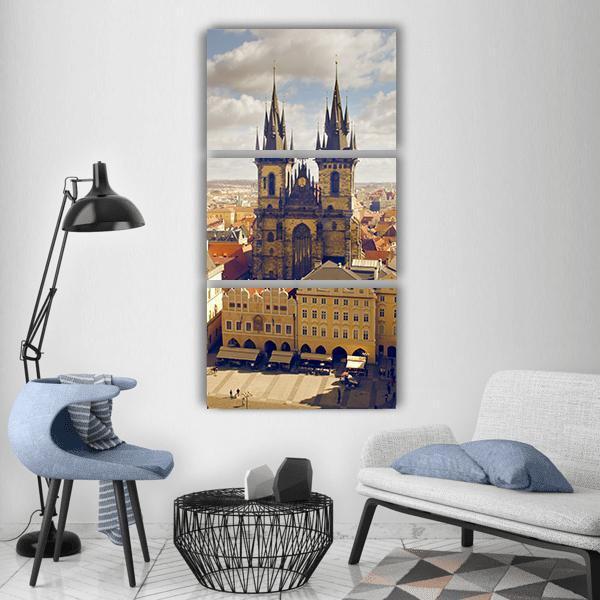 Prague Old Town Square with Týn Church Vertical Canvas Wall Art in beige, yellow and blue, hung on a wall