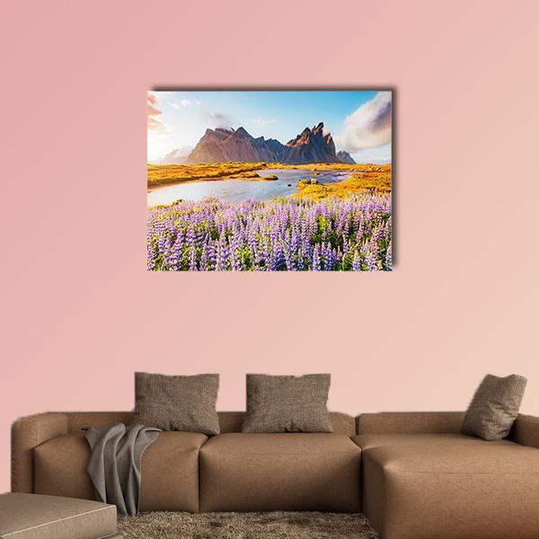 Purple Lupine Field with Mountains Canvas Wall Art in yellow, blue and purple, single panel hung on a wall