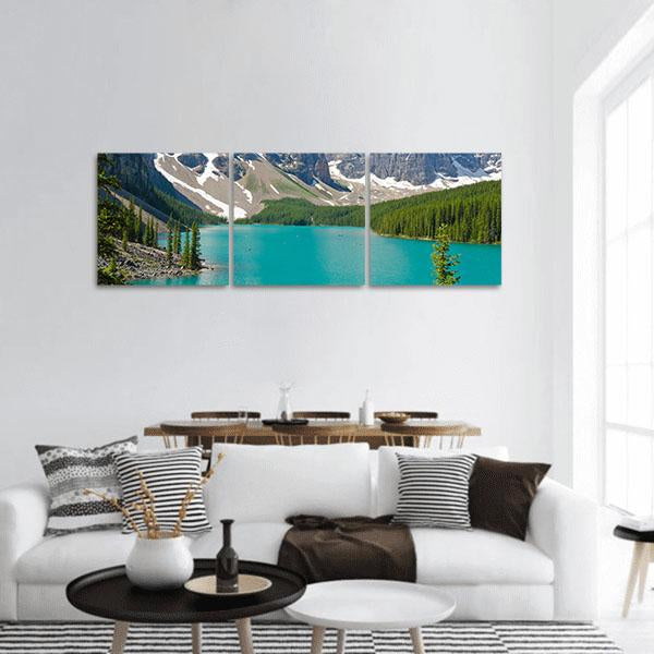 Moraine Lake with Turquoise Water Panoramic Canvas Wall Art in gray, green and blue, hung on a wall