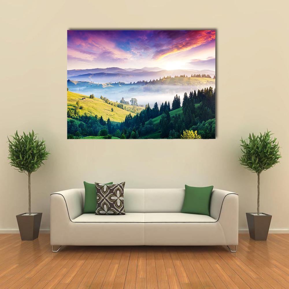 Majestic Mountain Landscape Canvas Wall Art in green, blue and purple, single panel hung on a wall