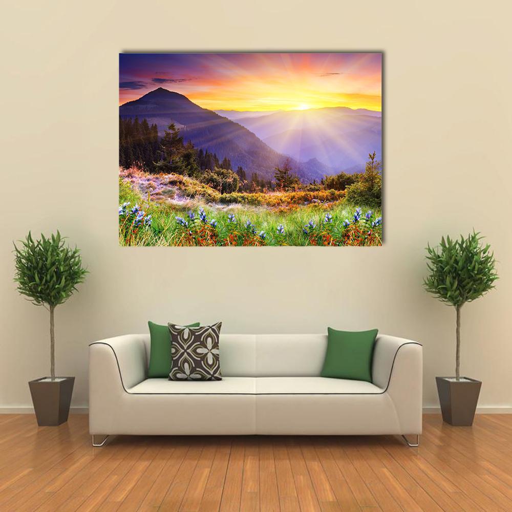 Majestic Sunset Over Mountains Canvas Wall Art in orange, yellow and purple, single panel hung on a wall