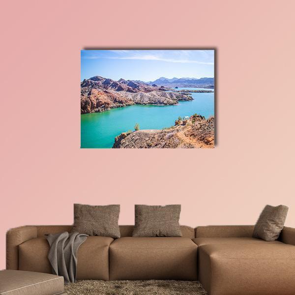 Balanced Rock Cove Turquoise Lake Canvas Wall Art in brown and blue, single panel hung on a wall