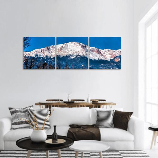 Pikes Peak in Colorado Panoramic Canvas Wall Art in white and blue, hung on a wall