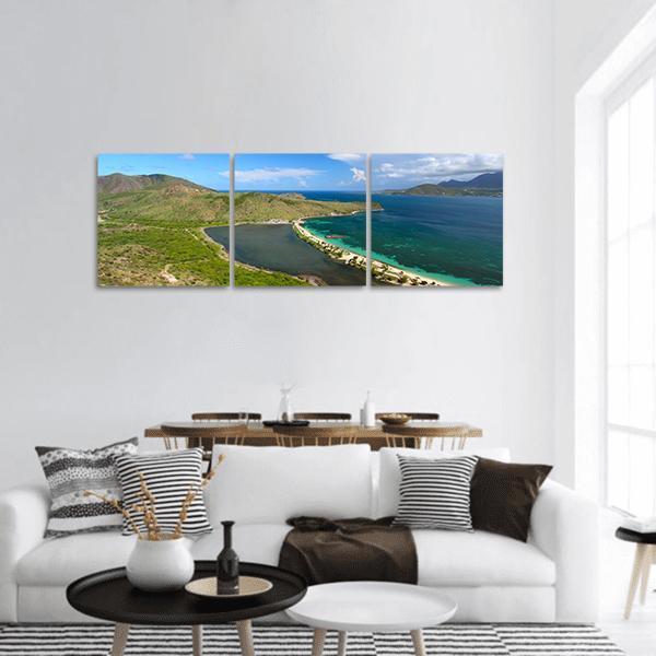 Aerial Sandbar Between Lagoon and Ocean Panoramic Canvas Wall Art in beige, green and blue, hung on a wall