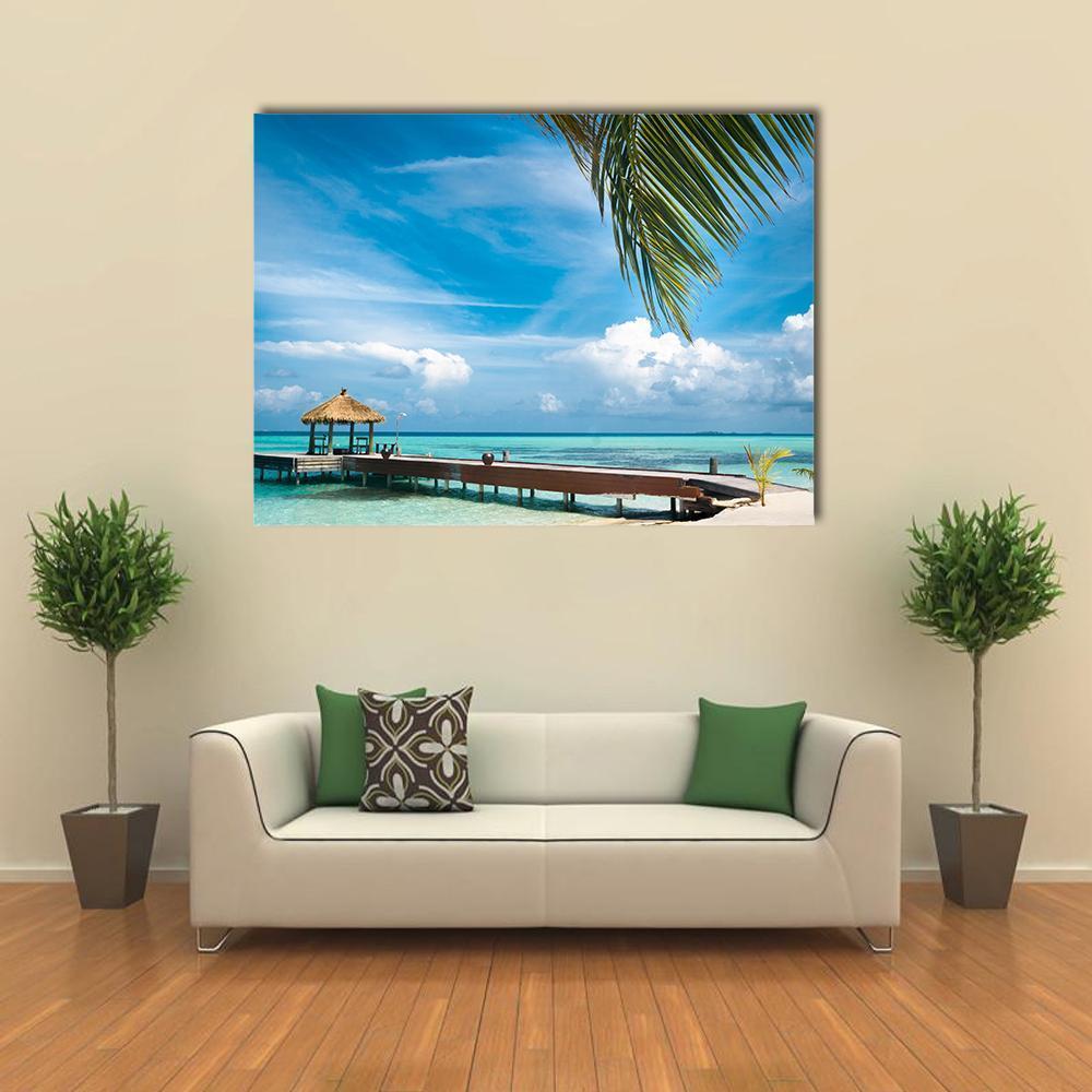 Tropical Jetty at Maldives Island Canvas Wall Art in white, green and blue, single panel hung on a wall