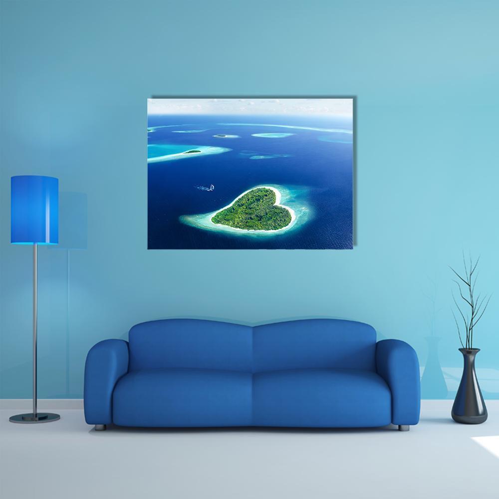 Heart-shaped Island Aerial View Canvas Wall Art in white, green and blue, single panel hung on a wall