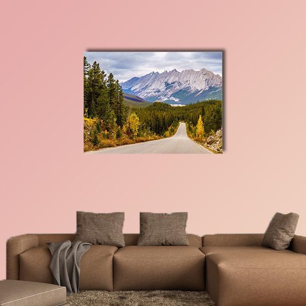 Maligne Lake Road Canvas Wall Art in gray, green and blue, single panel hung on a wall