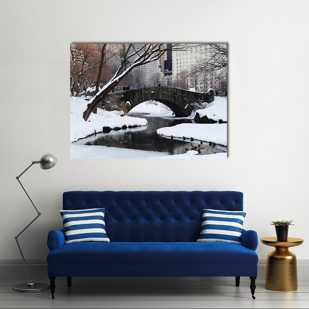 Gapstow Bridge in Winter Snow Canvas Wall Art in white, gray and brown, single panel hung on a wall