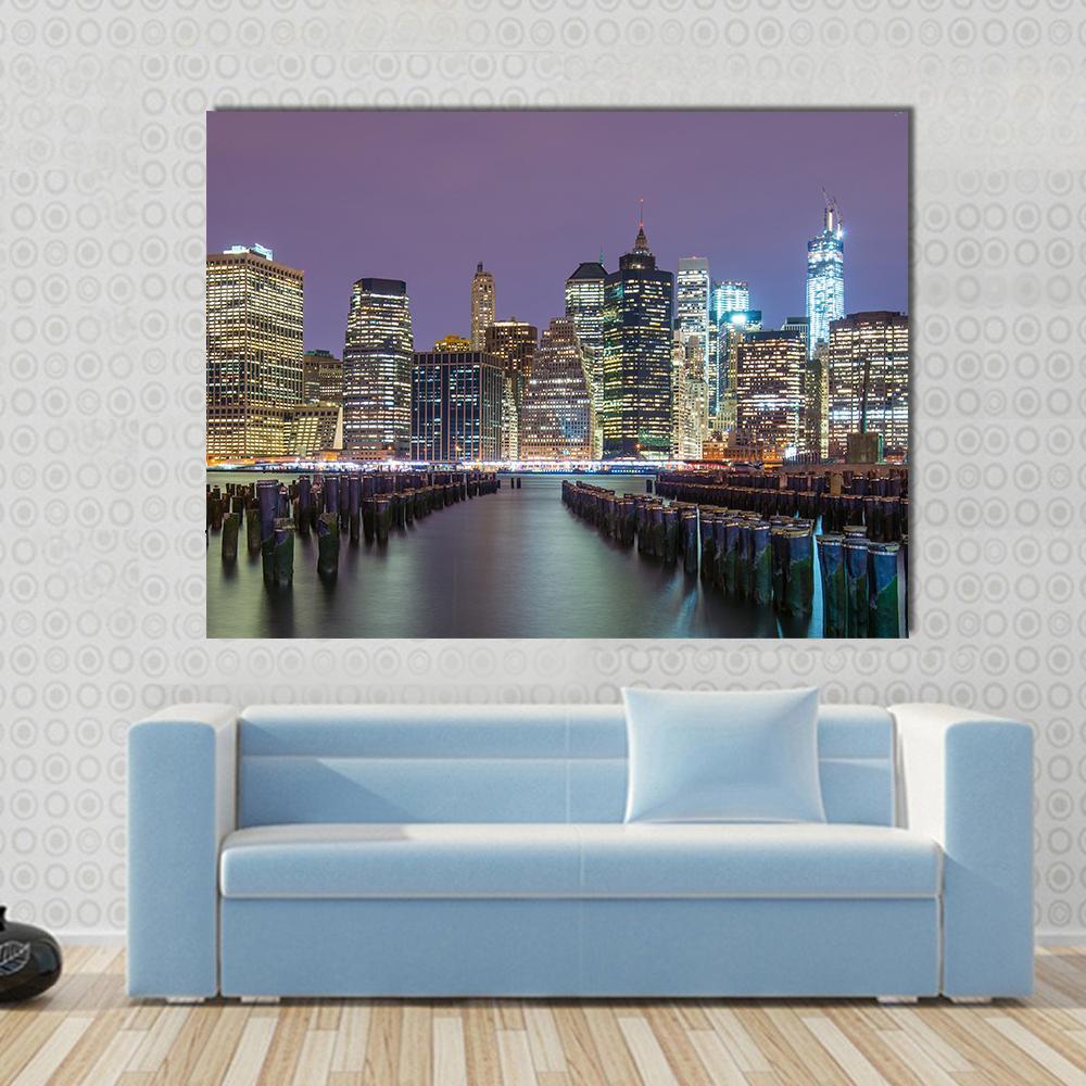 Lower Manhattan Skyline Canvas Wall Art in black, blue and purple, single panel hung on a wall