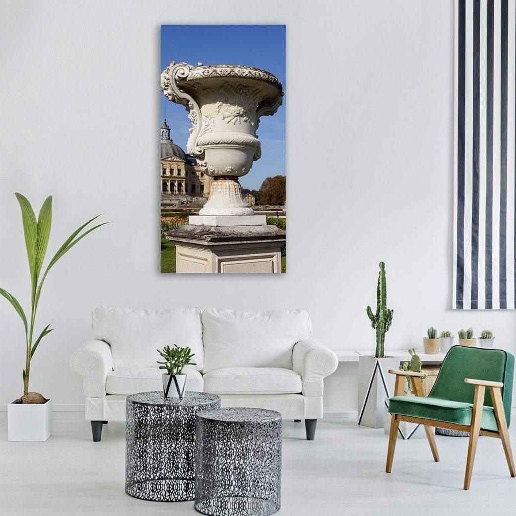 Ornate Stone Urn at Domed Chateau Vertical Canvas Wall Art in gray, beige and blue, single vertical panel hung on a wall