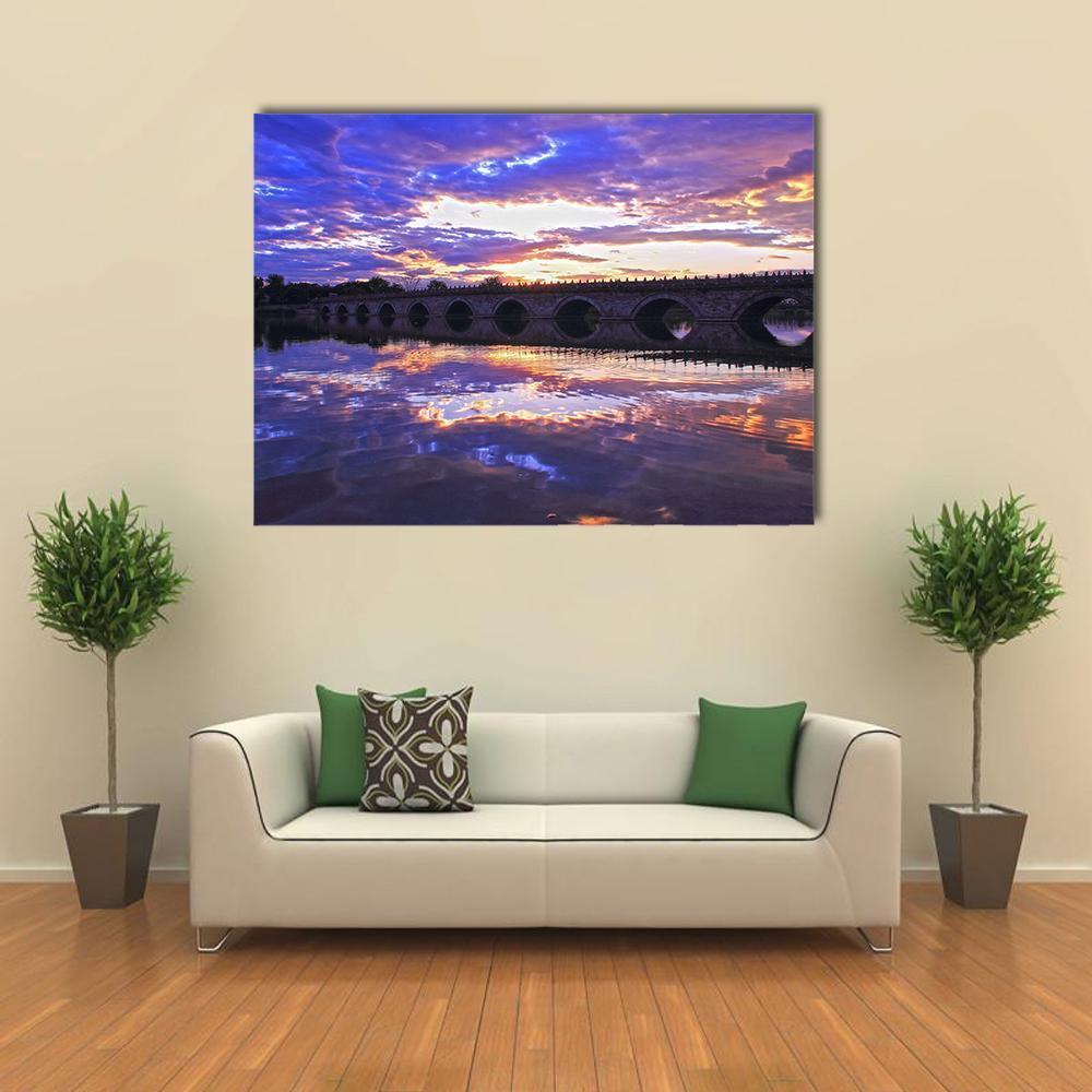 Marco Polo Bridge, Beijing at Sunset Canvas Wall Art in orange, blue and purple, single panel hung on a wall