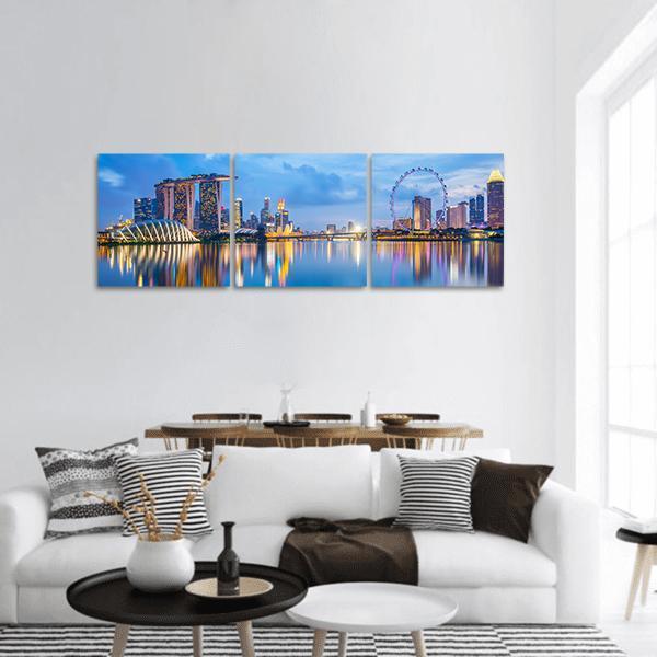 Marina Bay at Twilight Panoramic Canvas Wall Art in gold, blue and purple, hung on a wall