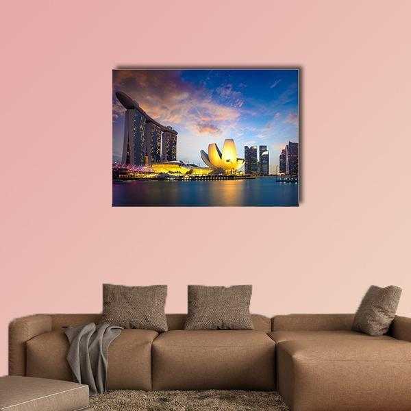 Marina Bay at Dusk Canvas Wall Art in orange, yellow and blue, single panel hung on a wall