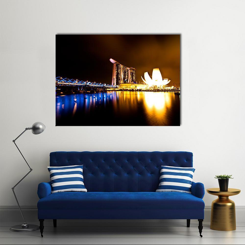 Marina Bay at Night Canvas Wall Art in black, yellow and blue, single panel hung on a wall