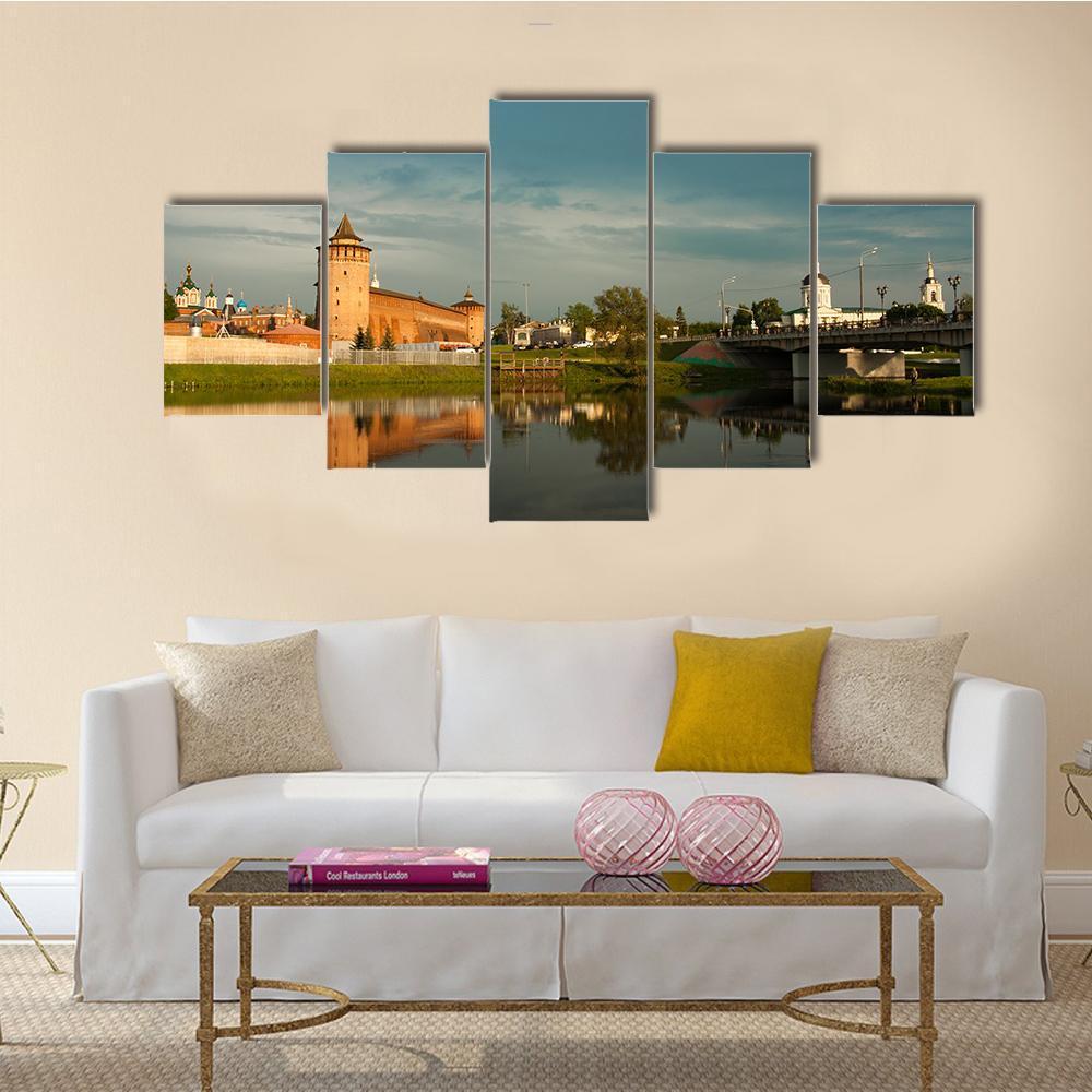 Marinkin Tower with Church Canvas Wall Art in brown, orange and blue, 5 panel Star layout hung on a wall