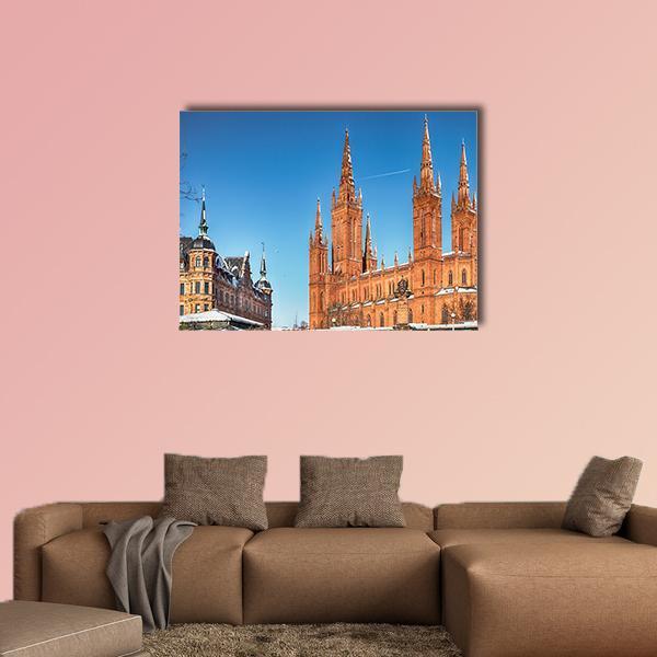 Market Church and Town Hall in Winter Canvas Wall Art in brown, orange and blue, single panel hung on a wall