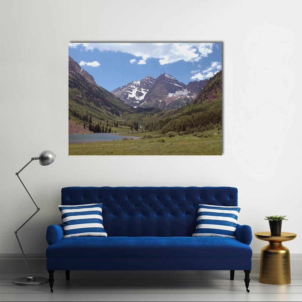 Maroon Bells Reflections in Lake Canvas Wall Art in brown, green and blue, single panel hung on a wall