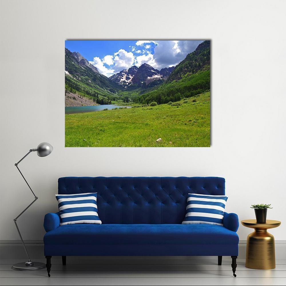 Maroon Bells in Aspen Canvas Wall Art in white, green and blue, single panel hung on a wall