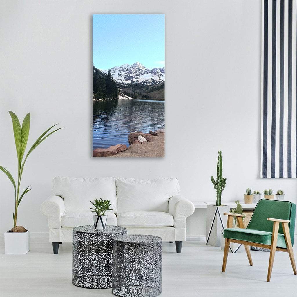 Maroon Bells, Colorado Vertical Canvas Wall Art in white, gray and blue, single vertical panel hung on a wall