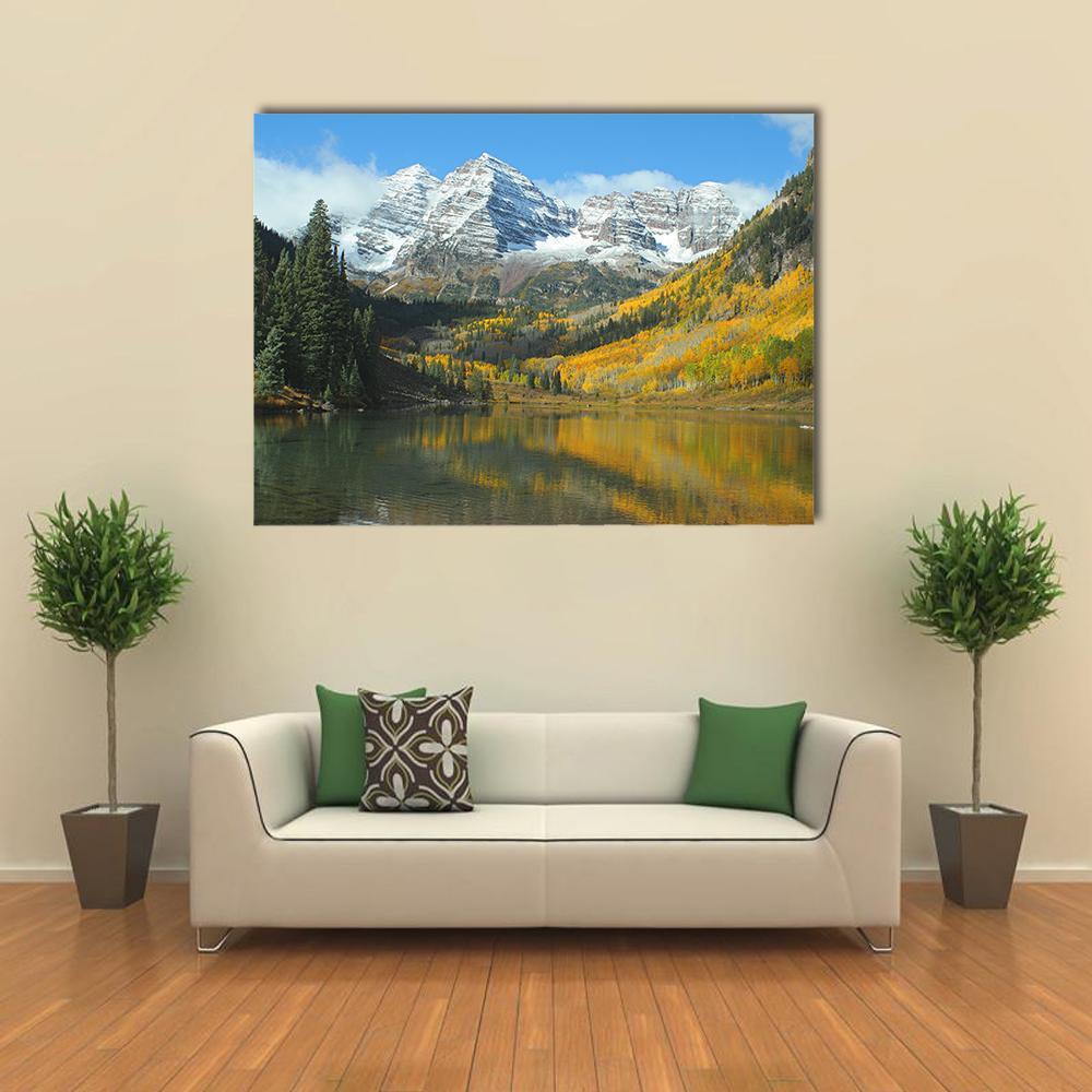 Maroon Lake in Autumn Canvas Wall Art in yellow, green and blue, single panel hung on a wall