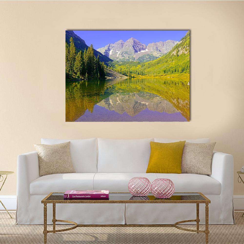Maroon Bells Reflected on Lake Canvas Wall Art in yellow, green and blue, single panel hung on a wall