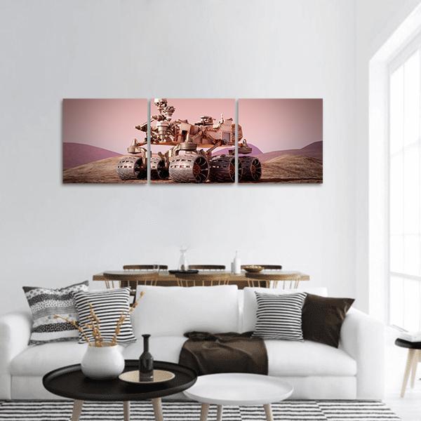 Six-wheeled Mars Rover on Dusty Plains Panoramic Canvas Wall Art in beige, brown and pink, hung on a wall