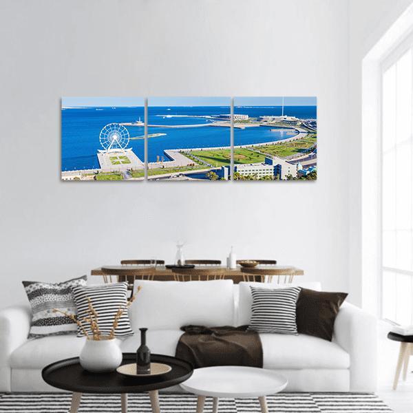 Aerial Bay with Ferris Wheel Panoramic Canvas Wall Art in white, green and blue, hung on a wall