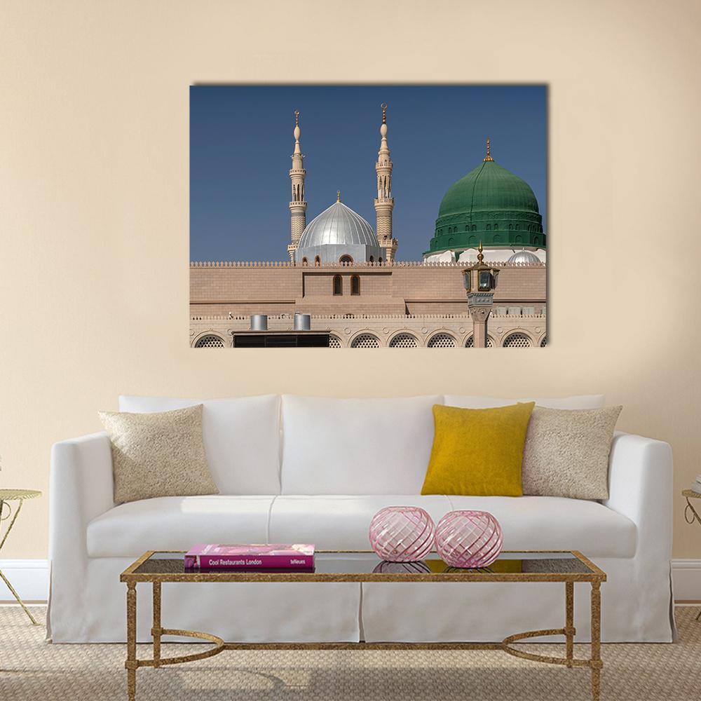 Green Dome of Al-masjid An-nabawi Canvas Wall Art in beige, green and blue, single panel hung on a wall