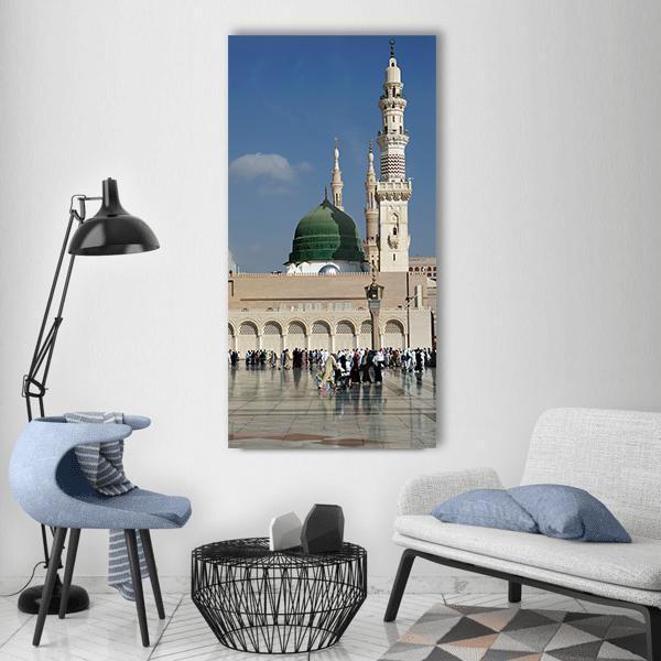 Al-masjid An-nabawi Green Dome Vertical Canvas Wall Art in beige, green and blue, single vertical panel hung on a wall
