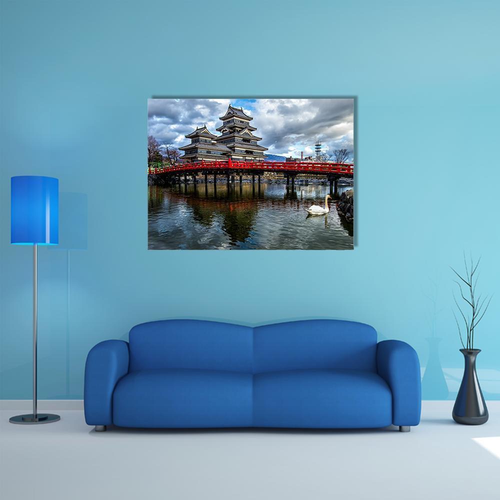 Matsumoto Castle with Red Bridge Canvas Wall Art in gray, red and blue, single panel hung on a wall