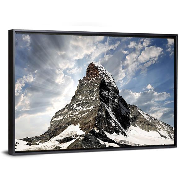 Matterhorn with Sun Rays Breaking Through Clouds Canvas Wall Art in white, gray and blue, framed canvas, product view on a white background
