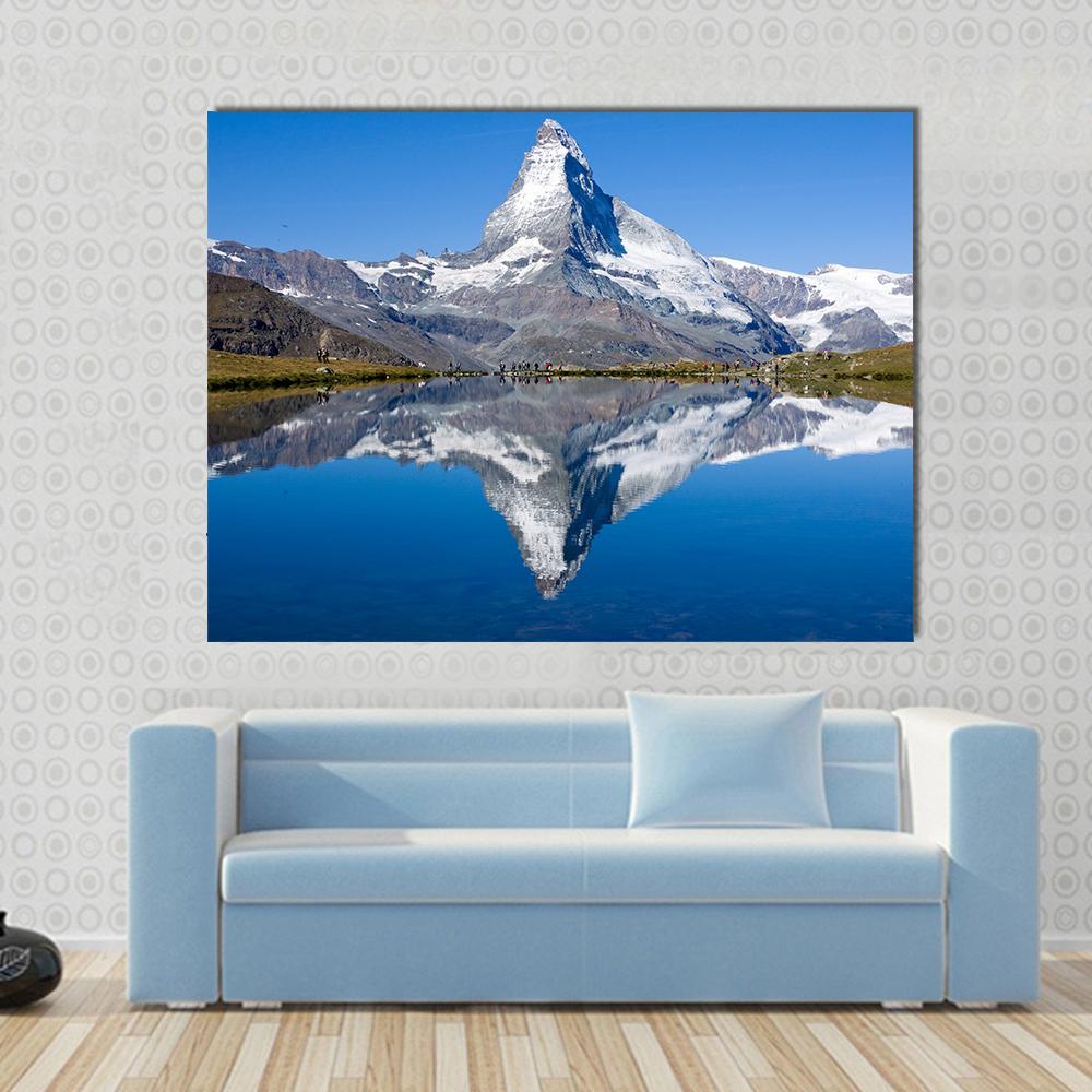Matterhorn Mountain Reflection Canvas Wall Art in white, brown and blue, single panel hung on a wall